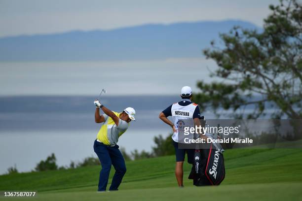 Hideki Matsuyama of Japan hits from the fairway on the fourth hole during the final round of The Farmers Insurance Open on the South Course at Torrey...