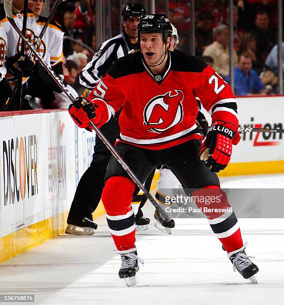 Cam Janssen of the New Jersey Devils calls for a line change as he skates to the bench during an NHL hockey game against the Boston Bruins at...
