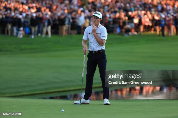 Will Zalatoris reacts to a missed putt on the 18th hole during the final round of The Farmers Insurance Open on the South Course at Torrey Pines Golf...