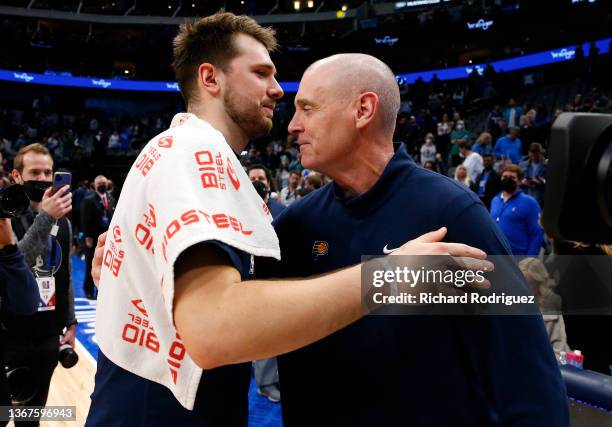 Luka Doncic of the Dallas Mavericks hugs Rick Carlisle head coach of the Indiana Pacers after the game at American Airlines Center on January 29,...