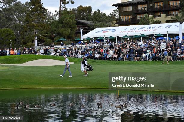 Luke List walks on the 18th hole during the final round of The Farmers Insurance Open on the South Course at Torrey Pines Golf Course on January 29,...