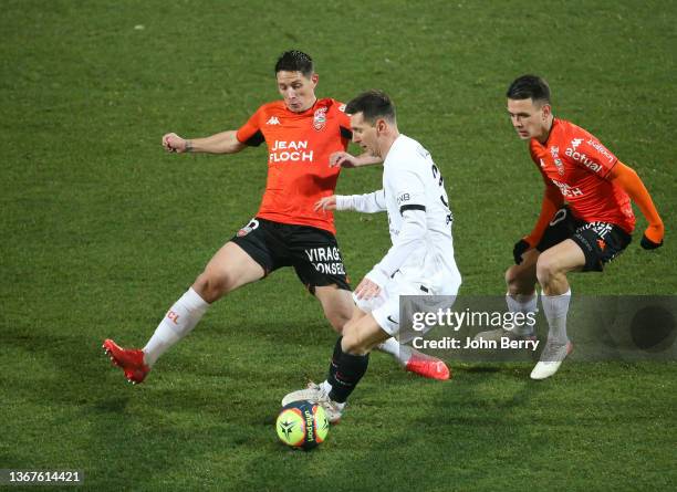 Lionel Messi of PSG, Laurent Abergel , Enzo Le Fee of Lorient during the Ligue 1 Uber Eats match between FC Lorient and Paris Saint-Germain at Stade...