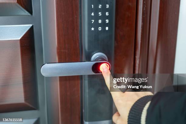 close up of fingerprint unlock to open house door - access control stock pictures, royalty-free photos & images