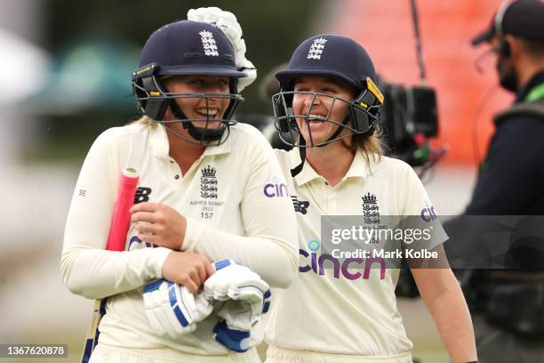 Sophie Ecclestone and Kate Cross of England leave the field after the match finished in a draw during day four of the Women's Test match in the Ashes...