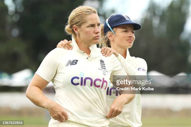 Katherine Brunt and Charlie Dean of England leave the field after the match finished in a draw during day four of the Women's Test match in the Ashes...