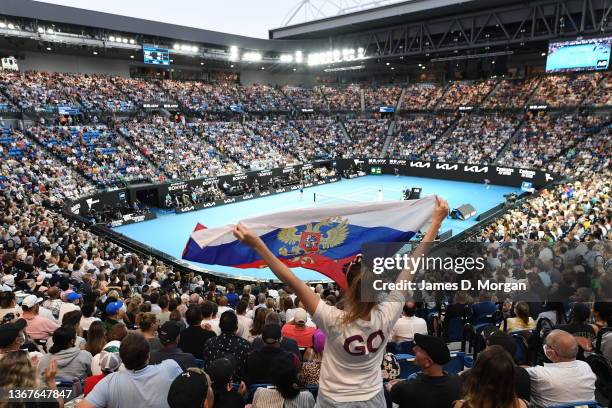 Fans hold up the Russian flag on Rod Laver Arena during the Men's Singles Final match between Rafael Nadal of Spain and Daniil Medvedev of Russia...