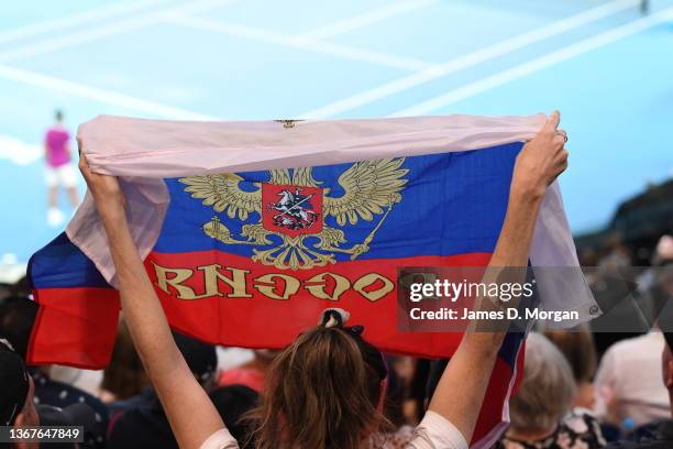 Fans hold up the Russian flag on Rod Laver Arena during the Men's Singles Final match between Rafael Nadal of Spain and Daniil Medvedev of Russia...