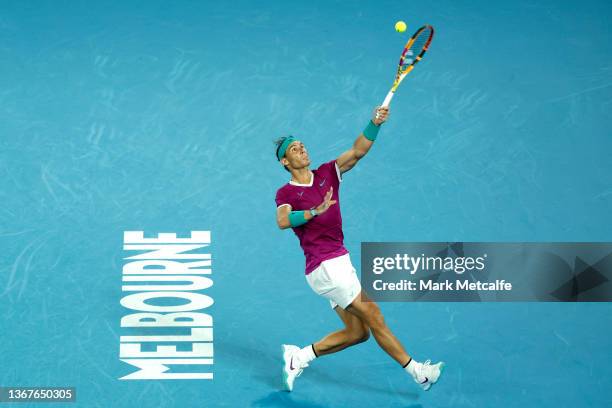 Rafael Nadal of Spain plays a shot over his head in his Men's Singles Final match against Daniil Medvedev of Russia during day 14 of the 2022...