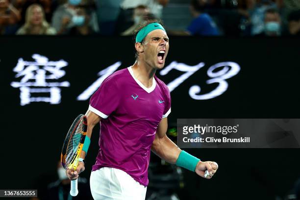 Rafael Nadal of Spain celebrates winning set point in his Men's Singles Final match against Daniil Medvedev of Russia during day 14 of the 2022...