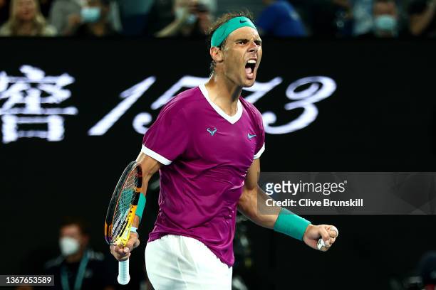 Rafael Nadal of Spain celebrates winning set point in his Men's Singles Final match against Daniil Medvedev of Russia during day 14 of the 2022...
