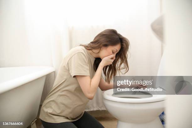 pregnant woman having morning sickness - vomiting stock pictures, royalty-free photos & images