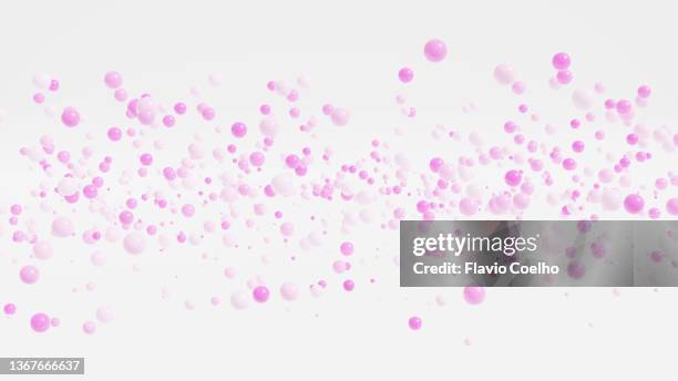 pink paint splatter on white background - bead foto e immagini stock