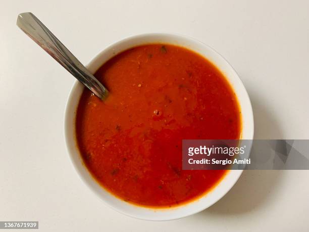 tomato and basil soup - soup on spoon stock pictures, royalty-free photos & images