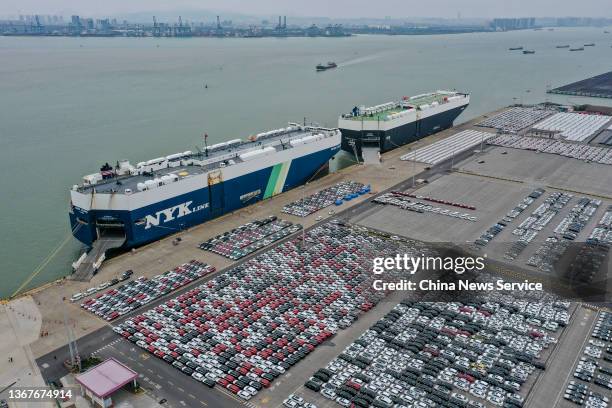 Aerial view of Dongfeng vehicles waiting to be loaded onto a roll-on-roll-off ship of NYK Line at Guangzhou Port on January 29, 2022 in Guangzhou,...