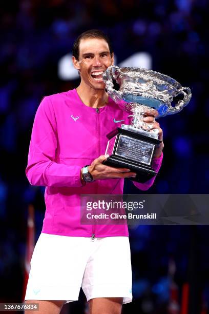 Rafael Nadal of Spain poses with the Norman Brookes Challenge Cup as he celebrates victory in his Men’s Singles Final match against Daniil Medvedev...