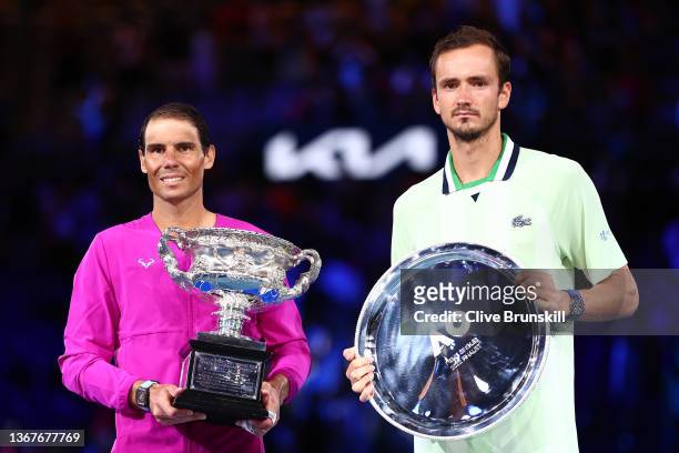 Rafael Nadal of Spain and Daniil Medvedev of Russia pose during the trophy presentation for the Men’s Singles Final match during day 14 of the 2022...