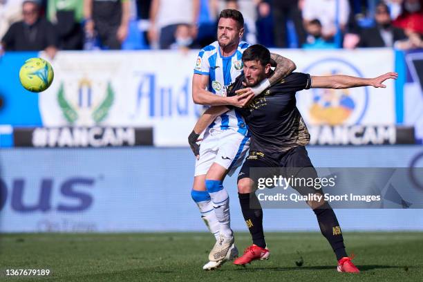 Xavi Quintilla of CD Leganes battle for the ball with Antonio Moyano AD Alcorcon during the LaLiga Smartbank match between CD Leganes and AD Alcorcon...