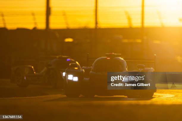 The Cadillac Chip Ganassi Racing Cadillac DPi of Renger Van Der Zande, Scott Dixon, Sebastien Bourdais, and Alex Palou drives during sunrise at the...