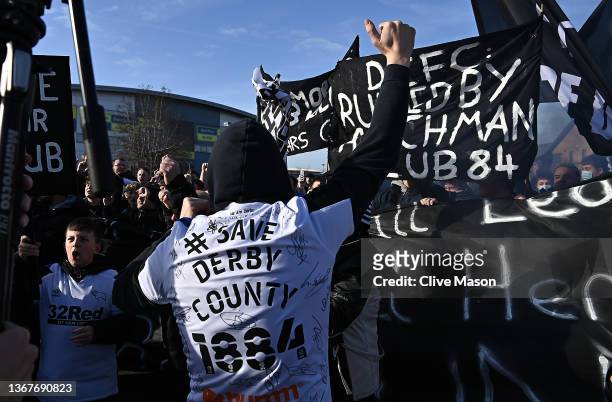 Derby County fans are seen during a march outside the stadium ahead of the Sky Bet Championship match between Derby County and Birmingham City at...