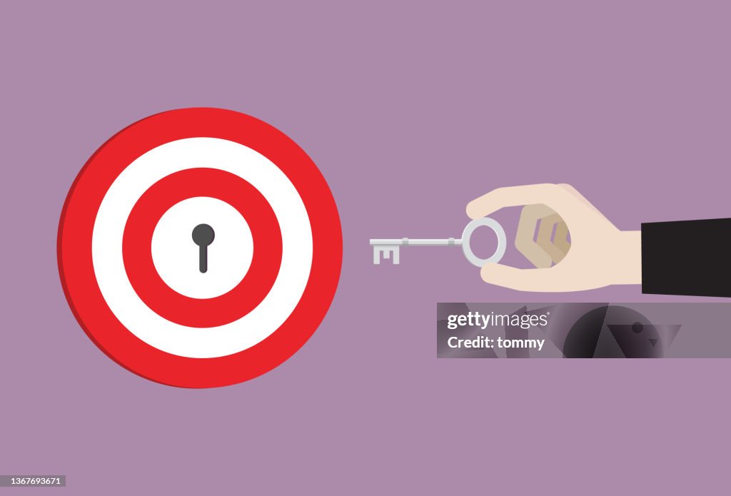Businessman Uses A Key Unlock A Target High-Res Vector Graphic - Getty ...