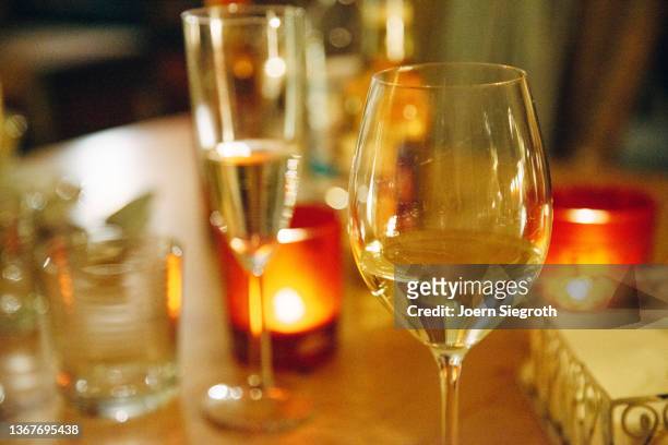 glass of wine on a table - red wine foto e immagini stock
