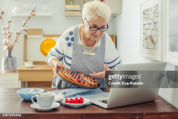 senior woman at home - zoom birthday stock pictures, royalty-free photos & images