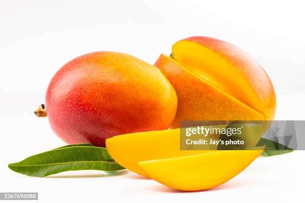 fresh sliced mango isolated on white background. - mango fruit stock pictures, royalty-free photos & images