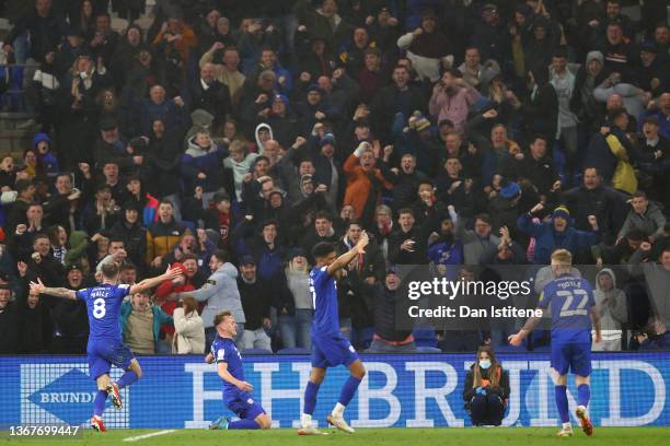 Isaak Davies of Cardiff City celebrates after scoring their side's second goal with team mates during the Sky Bet Championship match between Cardiff...