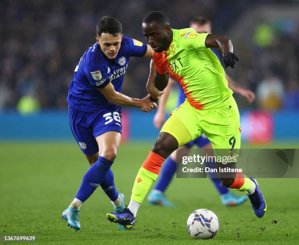 Keinan Davis of Nottingham Forest battles for possession with Perry Ng of Cardiff City during the Sky Bet Championship match between Cardiff City and...