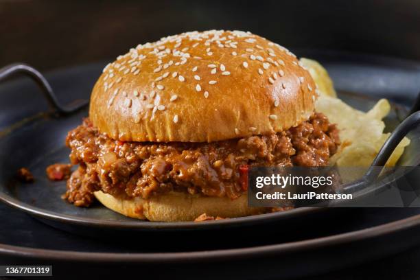 sloppy joe burger on a brioche sesame seed bun with potato chips - cheddar cheese stock pictures, royalty-free photos & images