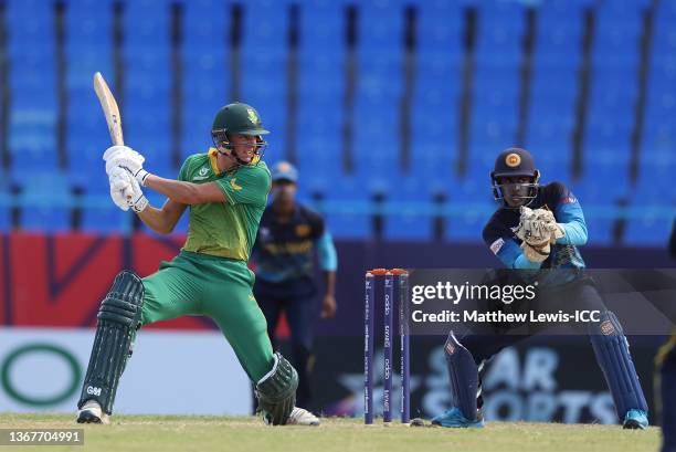 Gerhardus Maree of South Africa hits out ahead of Anjala Bandara of Sri Lanka during the ICC U19 Men's Cricket World Cup match between South Africa...