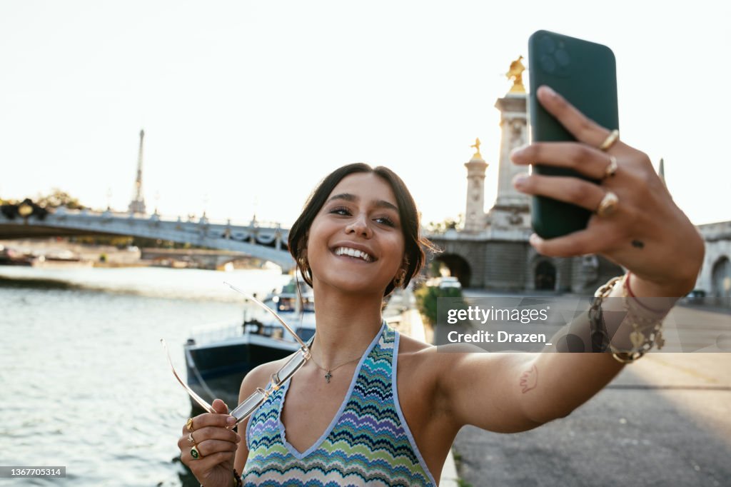 Attractive young woman exploring city of paris