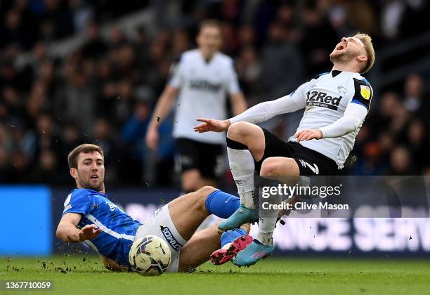 Kamil Jozwiak of Derby County is challenged by Gary Gardner of Birmingham City during the Sky Bet Championship match between Derby County and...