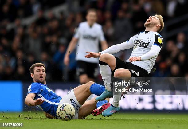 Kamil Jozwiak of Derby County is challenged by Gary Gardner of Birmingham City during the Sky Bet Championship match between Derby County and...
