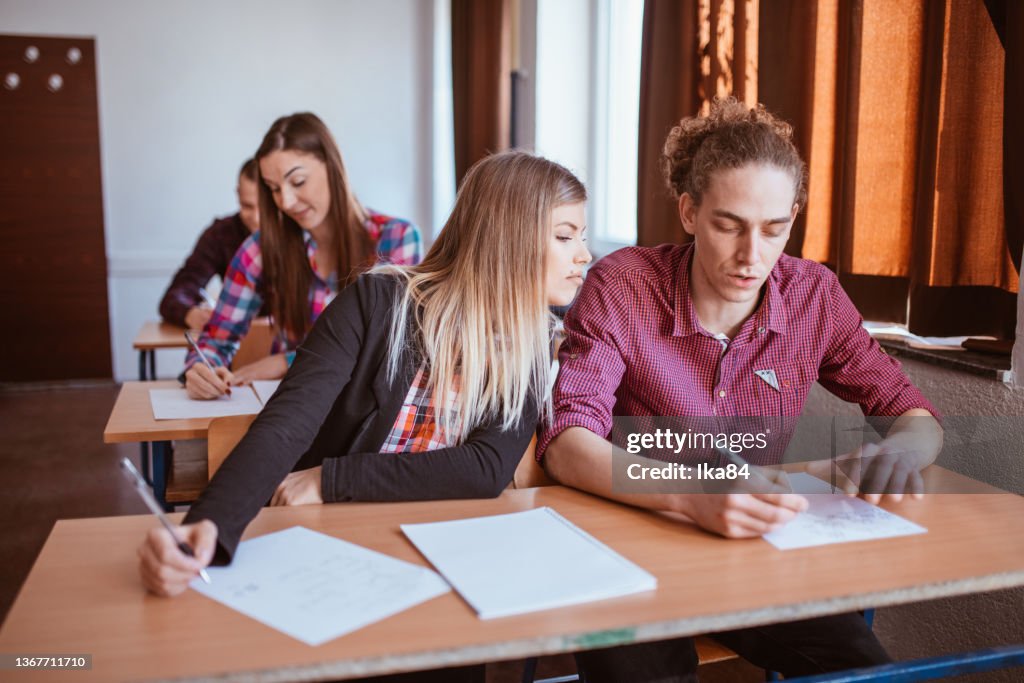 Students Attending A Class In University Classroom High-Res Stock Photo ...