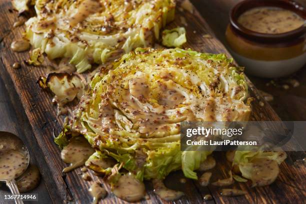 roasted cabbage steaks with mustard vinaigrette - cabbage stock pictures, royalty-free photos & images