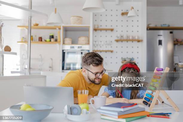 father helps her daughter with homework - dad homework stock pictures, royalty-free photos & images