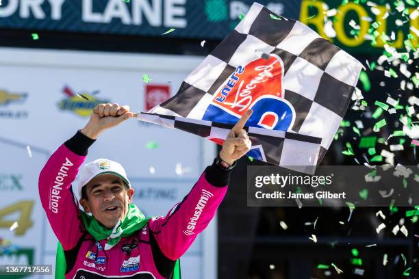 Helio Castroneves of Brazil, driver of the Meyer Shank Racing w/ Curb-Agajanian Acura DPi celebrates with his team in victory lane after winning the...