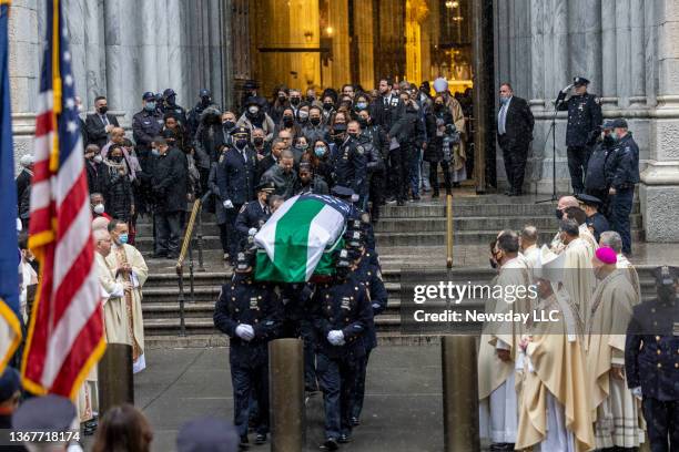 New York Police pall bearers carry the casket of NYPD Officer Jason Rivera out of St. Patrick's Cathedral after his funeral service, on Jan. 28 in...