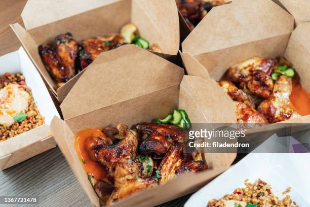 chicken wings packed to take away - takeaway box stock pictures, royalty-free photos & images