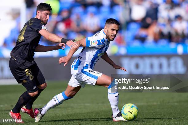 Recio of CD Leganes battle for the ball with Borja Valle of AD Alcorcon during the LaLiga Smartbank match between CD Leganes and AD Alcorcon at...
