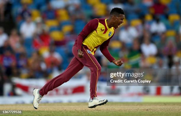 Akeal Hosein of the West Indies celebrates dismissing Jason Roy of England during the 5th T20 International match between West Indies and England at...