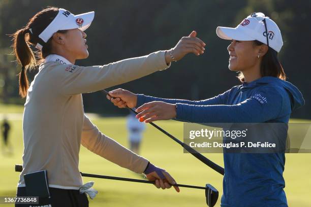 Lydia Ko of New Zealand and Danielle Kang hug on the 18th green after Lydia defeats Danielle by one stroke to win the 2022 Gainbridge LPGA at Boca...