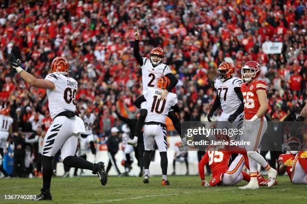 Kicker Evan McPherson of the Cincinnati Bengals celebrates after kicking the game winning field goal in overtime against the Kansas City Chiefs in...