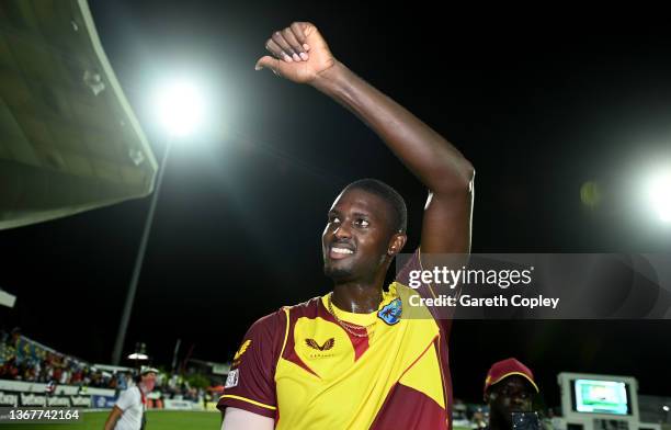 Jason Holder of the West Indies celebrates after winning the 5th T20 International match between West Indies and England at Kensington Oval on...