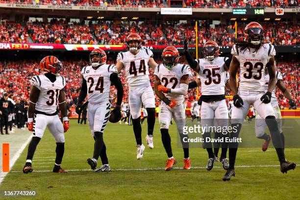 Members of the Cincinnati Bengals defense celebrate after safety Vonn Bell intercepted the Kansas City Chiefs in overtime of the AFC Championship...