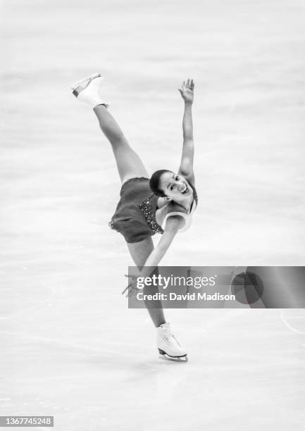 Michelle Kwan of the USA skates her short program in the Ladies Singles event of the figure skating competition in the 1998 Winter Olympics held on...