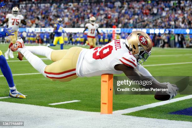 Deebo Samuel of the San Francisco 49ers dives to score a touchdown in the second quarter against the Los Angeles Rams in the NFC Championship Game at...