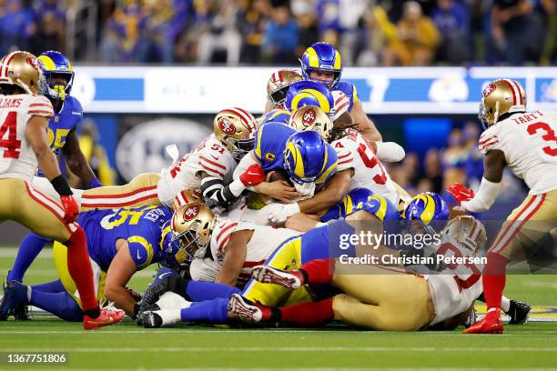 Matthew Stafford of the Los Angeles Rams dives on fourth down against the San Francisco 49ers in the NFC Championship Game at SoFi Stadium on January...