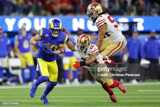 Cooper Kupp of the Los Angeles Rams runs after a catch in the fourth quarter against Fred Warner and K'Waun Williams of the San Francisco 49ers in...